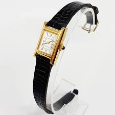 Off white with light gray, black, and gold tone detail. Bulova Watches For Men And Women Bulova Vintage Watches Vintageradar Vintage Radar