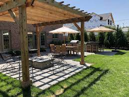 The fire pit in your patio architectures is great idea and having this fire pit under your pergola is really a romantic and warming place. Multi Patio Space With Pergola Outdoor Kitchen With Pub Seating Glenview Il Northbrook Decks Pergolas Stone Paver Patios