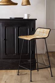 black framed natural rattan bar stool