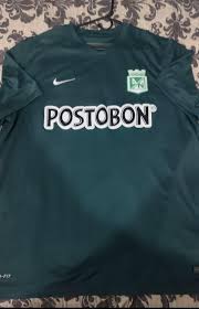 Atlético Nacional Away football shirt 2015. Sponsored by Postobon