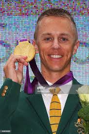 Australian athelete Jared Tallent poses with his Olympic gold medal... News  Photo