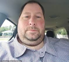 Uber driver who claimed coronavirus was 'made-up' says from hospital that  he wishes he was careful