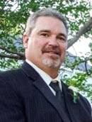 Mark D. Henderson ... grew up in Rochester; at 57