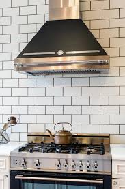 It is a very white kitchen aesthetically, i usually suggest white grout with white subway to allow the countertop stone to i like the tiles to pop. White Kitchen Subway Tiles With Black Grout Kitchen Backsplash