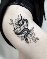 The pattern of this tattoo is composed of a floral pattern mixed with textured artwork. 32 Small Snake Tattoo Models For 2021 Small Tattoos Ideas