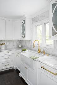 white cabinets with polished brass