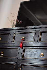A short dresser in the bedroom makes room for folded clothes while keeping a low profile beneath a window or to accommodate a another idea: Gold Paint Sharpie On The Inside Edge Of The Drawer Bevel Painting Furniture Diy Refinishing Furniture Diy Diy Furniture Upgrade
