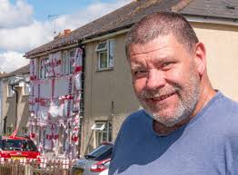Our next-door neighbour has covered his ENTIRE house in England flags for  the Euros