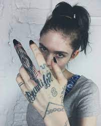 Grimes has just debuted a white ink back tattoo, which she described as beautiful alien scars. Grimes New Tattoo Claire Boucher Tattoos Hand Tattoos