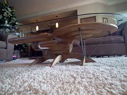 The bottom shelf is equally multifunctional—leave it open to display coffee table books and magazines, or add some storage bins to keep toys, blankets, and other odds. Custom Star Wars X Wing Starfighter And Star Trek U S S Enterprise Coffee Tables Handcrafted From Wood