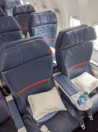 4c (first class) at the door i was greeted by two absolutely lovely flight attendants — good morning, welcome aboard! Flight Review Delta First Class New York Las Vegas On The 737