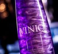 Elegant glass bottle enhances shimmering liqueurs ...