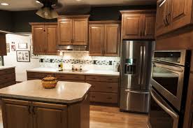 Staggered Wall Cabinets Are Accentuated By The Vaulted Ceiling Resulting In An Open Spacious Looking Kitchen Staggered Kitchen Cabinets Kitchen Kitchen Remodel