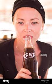 Coca cola drink woman hi-res stock photography and images