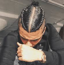 This Corn Row Fade Man Bun Combination Is Giving Us All The Feels Braided Hairdo Man Bun Hairstyles Two Braids Men