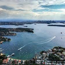See Sydney From A New Angle With Heliexperiences Fly Over The Stunning Sydney Harbour Watson S Bay Pictured Iconic Bondi Beac Bondi Beach Australia Tours