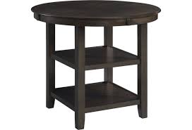 The beauty and practicality of the bolanburg dining room counter table is something to savor. Elements International Amherst 0180271 Round Counter Height Dining Table With Shelving Becker Furniture Pub Tables