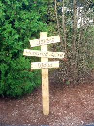 Winne The Pooh Hundred Acre Wood Sign Made With A Pallet Baby Shower Woodland Theme Winnie The Pooh Birthday Baby Shower Party Themes