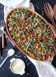 Roasted Sweet Potatoes And Arugula Come Together With Pine Nuts And A Mouth Watering Maple Bacon Vinai Paleo Salad Recipes Arugula Salad Roasted Sweet Potatoes