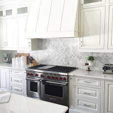 Just finished a large fireplace surround and herringbone about 30 minutes ago. Brighten Up Your Kitchen Home With This White And Grey Hue Marble Backsplash Tile Hampton L House Design Kitchen Marble Tile Kitchen Marble Mosaic Backsplash