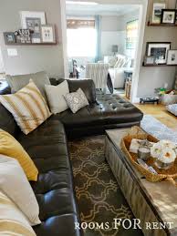 how to style a dark leather sofa den