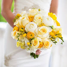 Wedding bouquets white and yellow. The Bridal Bouquet Was Full Of White Peonies And Roses And Yellow Ranunculuses And Freesia Yellow Bridal Bouquets Yellow Wedding Flowers Bridal Bouquet Peonies
