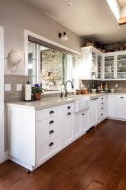 From rustic farmhouse to sleek modern kitchens, going with lighter shades offers versatility and beauty. Coastal Craftsman By The Bay Sligh Cabinets Inc