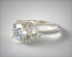 Art deco rings look as fresh now as they did when they were made, which is exactly why our selection of vintage art deco rings is so popular for engagement. Art Deco Inspired Flower Halo Engagement Ring 14k White Gold 17561w14