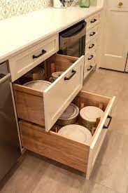Product photography and illustrations have been reproduced as taller items that normally don't fit in drawers will be easily accommodated with deep drawer base cabinets. Deep Dish Peg Drawers Modern Kitchen Houston By Cabinet Innovations Houzz