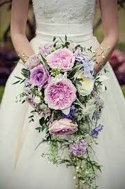 · wedding florists | 49.9 miles from lansing, mi. Romantic Cascading Bridal Bouquet Comprised Of Pink Lavender Purple Florals Mi Cascading Wedding Bouquets Cascading Bridal Bouquets Flower Bouquet Wedding