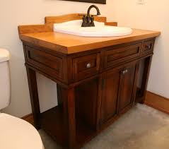 This custom wood bathroom vanity has a contemporary cabinet supporting a live edge countertop. Hand Crafted Custom Wood Bath Vanity With Reclaimed Sink By Moss Farm Designs Custommade Com