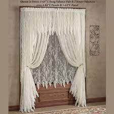 White lace curtains are a classic that can fit into any home. Wisteria Arbor Lace Window Treatments