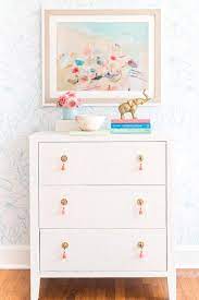 Maybe you would like to learn more about one of these? White Fabric Dresser With Pink Tassel Pulls Contemporary Bedroom