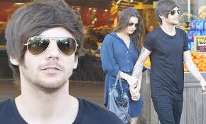 Louis Tomlinson's girlfriend Danielle Campbell holds onto her man during LA  grocery stop