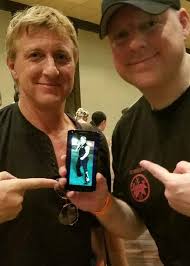 This picture has awesome written all over it! The man himself William Zabka  checking out a tattoo I did of him from the movie “Karate Kid”