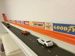 Normal straight pieces of hotwheels track. Tired Of That Hot Wheels Track Taking Up Valuable Floor Space Next To The Wall Get It Off The Floor And Storage Kids Room Hot Wheels Room Hot Wheels Bedroom