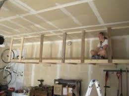 With a few readily available tools, you can set up a garage pulley system from the ceiling in a few short hours. Which Is A Better Overhead Garage Storage System For You A Shelf Is Good But Generally You Would Overhead Garage Storage Garage Storage Shelves Garage Decor