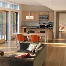 Open plan apartment with view of the kitchen and bed with dressing table on either side of a dividing white. Open Plan Kitchen Living Room Small Apartment Novocom Top