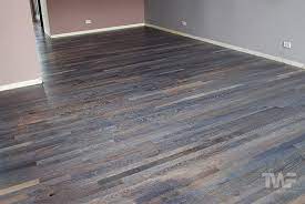 Gray and blue lace paint throughout bathrooms and bedrooms and new oak flooring. Custom Colored Hardwood Floors