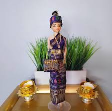 Noy is such a fashionista! 😍 Sis Siamphone Louankang told her she needed a  purse to go with her beautiful attire. So she went out and got this top of  the line