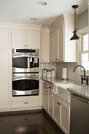 Off White Cape Cod Cabinets With Laminate Floor Google Search Off White Kitchen Cabinets Kitchen Renovation Off White Kitchens