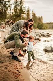 Adorable Family Of 3 Playing With Their Baby Next To The Spokane River Pnw During Golde Lifestyle Photography Family Family Photography Family Portrait Poses