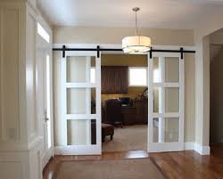 Ejemplo de recibidores y pasillos de estilo de casa de campo, de tamaño medio, con paredes blancas y suelo de madera en tonos medios — houzz. Another Great Way To Close Off The Front Room Office Love Barn Door Sliders Home Craftsman House House