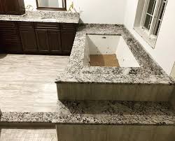 The first and most important step for tiling bathroom walls insists ferrante, is to start with a clean, stable substrate. Gorgeous Granite Whirlpool Tub Surround And Vanity A Bella Countertops