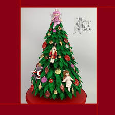 Each evergreen is decorated with a variety of ornaments, including santa claus, the nutcracker, the mouse king, and even clara. Nutcracker Ballet Themed Christmas Tree Cake Cake By Cakesdecor