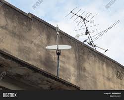 Turning a satellite dish into a wifi antenna can be both economical and efficient, because there is no signal loss using usb cable connections as. Home Satellite Dish Tv Image Photo Free Trial Bigstock