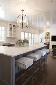 A clear lucite base supports an upholstered cowhide seat that almost seems to float in space. Kendra Kitchen Lucite Bar Stools Dream House House N Decor