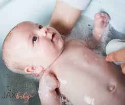 Although bathing a slippery, squirming read on to learn all about when to give your little one a bath, how to bathe your newborn, and how often your little one may need to be bathed during these first. Baby S First Bath Level Up With These Tips The Jax Baby Company