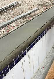 Typically, pool coping is designed with a graceful outward slant. Concrete Pool Coping Pool Repair St Louis Pool Restoration Pool Renovations H H Pools