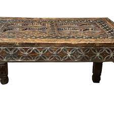 This is a traditional moroccan table in round shape in engraved metal the table has 3 legs and carved metal frame. Balsamo Antiques 19thc Moroccan Carved Wood Coffee Table